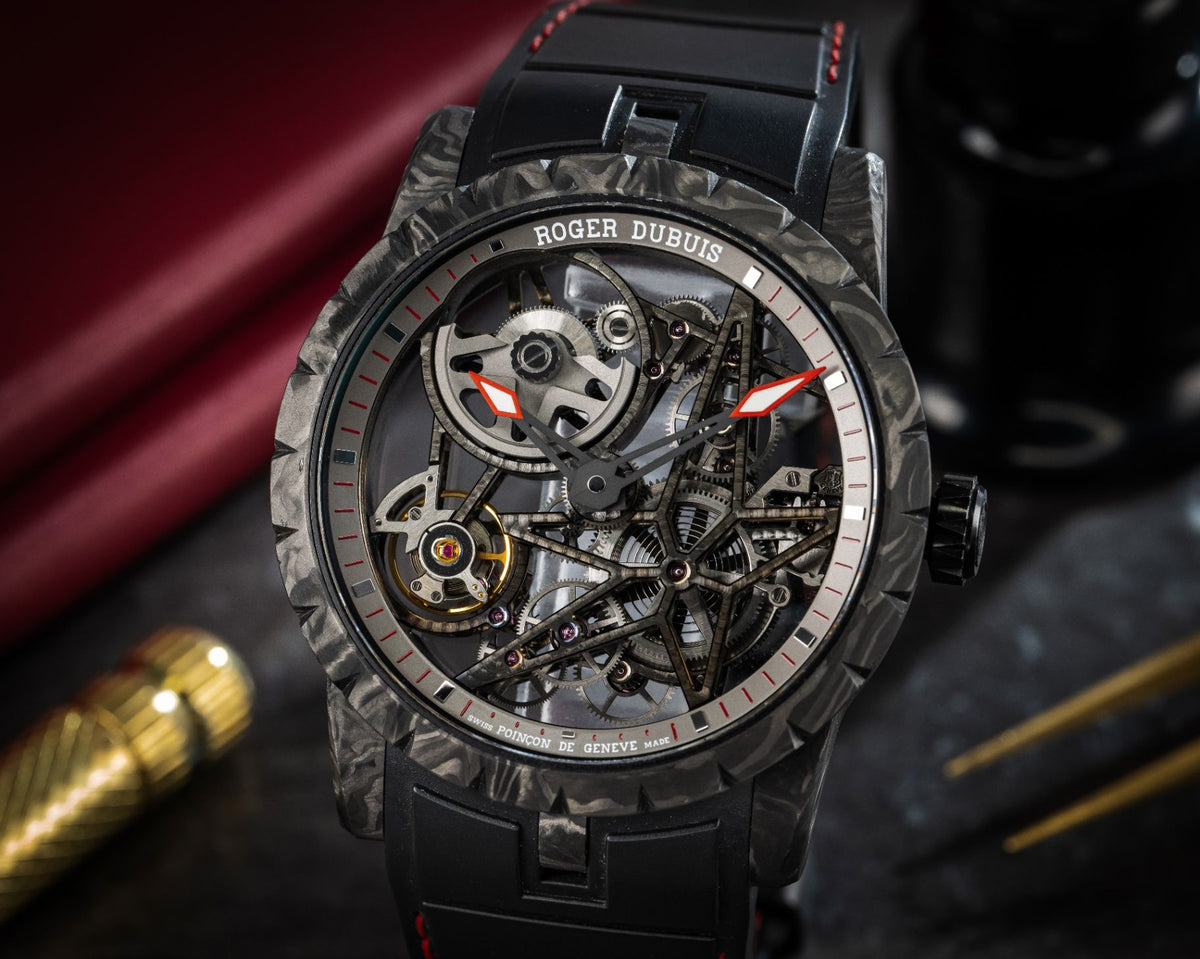 Roger Dubuis Excalibur Carbon RDDBEX0777 on a black rubber strap with red stitching